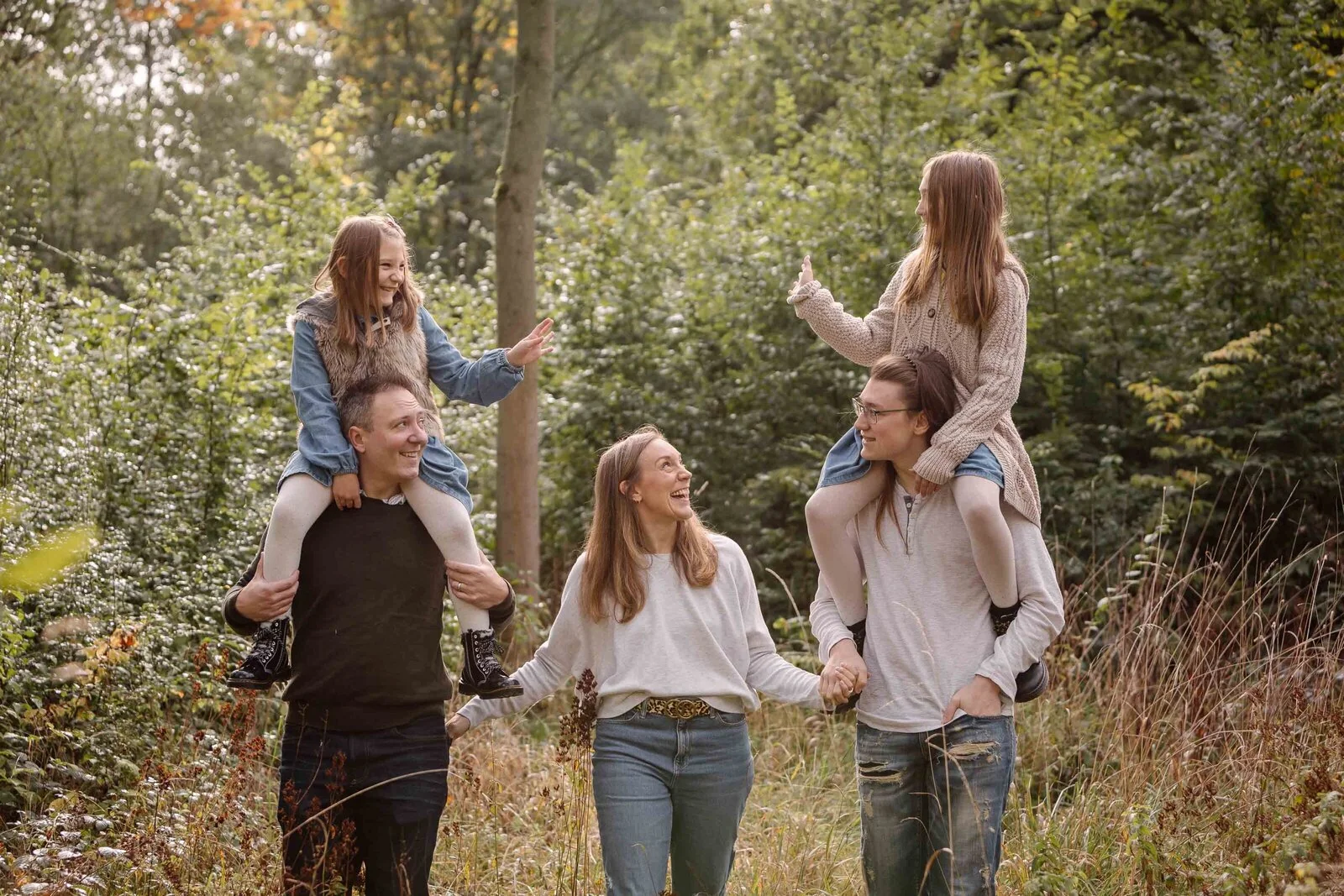 A family enjoying time together in an autumn woodland